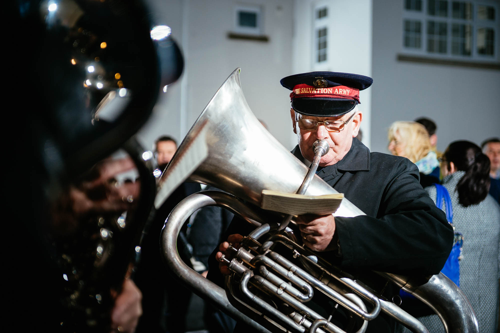 A photo of a salvation army band player in a cold wintery street in cardiff
